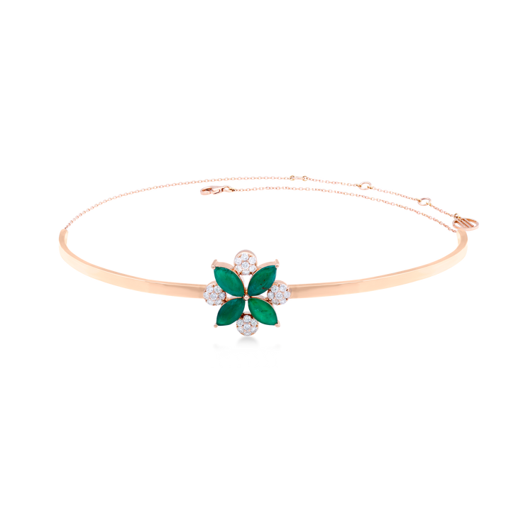 Quatrefoil inspired 18k rose gold with SI diamonds and emerald stones